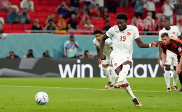 Alphonso Davies of Canada takes a penalty against Belgium in a Group F fixture at the 2022 World Cup in Qatar